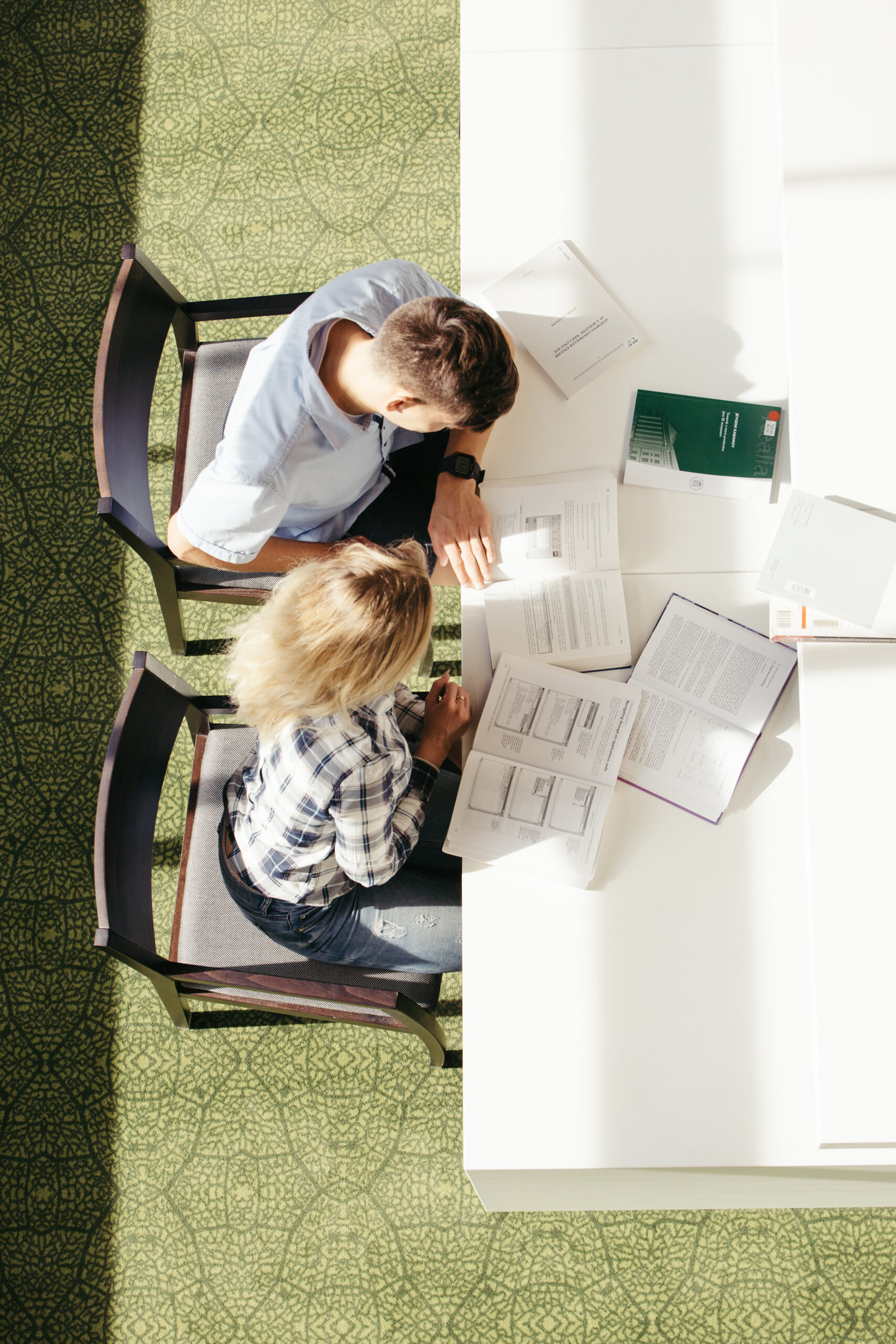 classmates-sitting-library-together